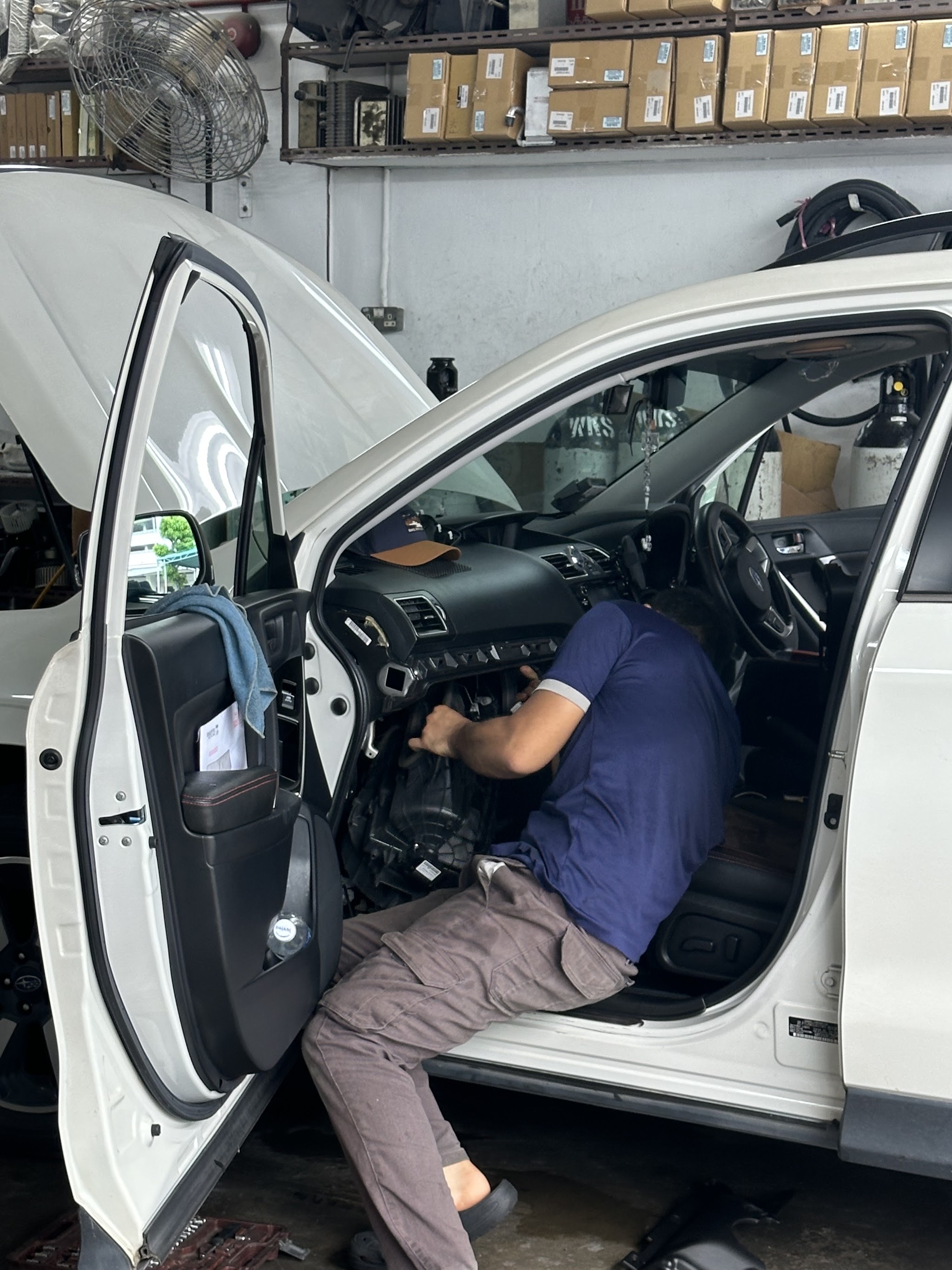 Car air-conditioning work at the Ubi Road 1 workshop